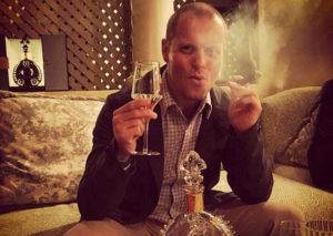 Tim Ferriss smoking a cigar
