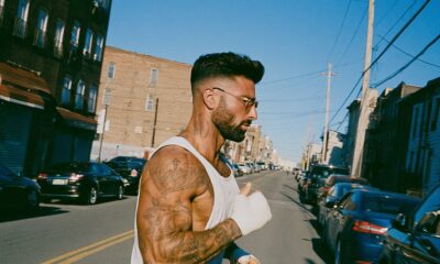 an Italian male motivated and very successful wearing a tank top struggling through his workout representing motivation and discipline