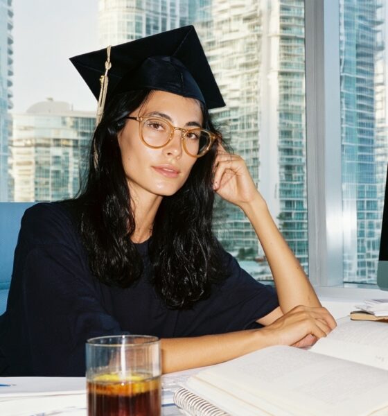 A Female MBA graduate working on a business plan on her computer