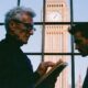 A father and son entrepreneur in London looking through inheritance tax projections before succession