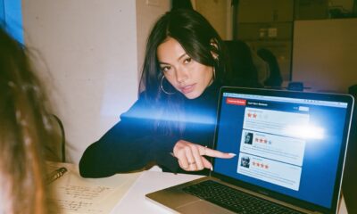 A female Entrepreneur looking at reviews on their online business store