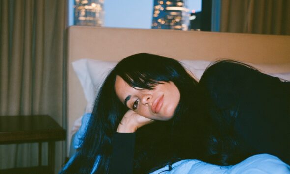 A female entrepreneur getting to bed early to get well rested sleep