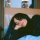 A female entrepreneur getting to bed early to get well rested sleep