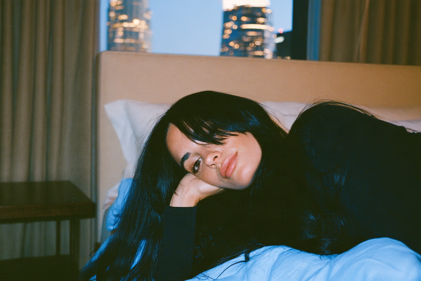 A female entrepreneur getting to bed early to get well rested sleep