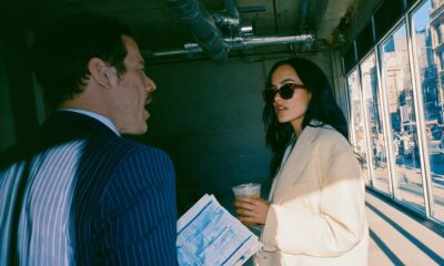 A male franchise owner speaking with a female entrepreneur about a franchise deal on location