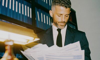 A male lawyer looking through records to help his client win a case