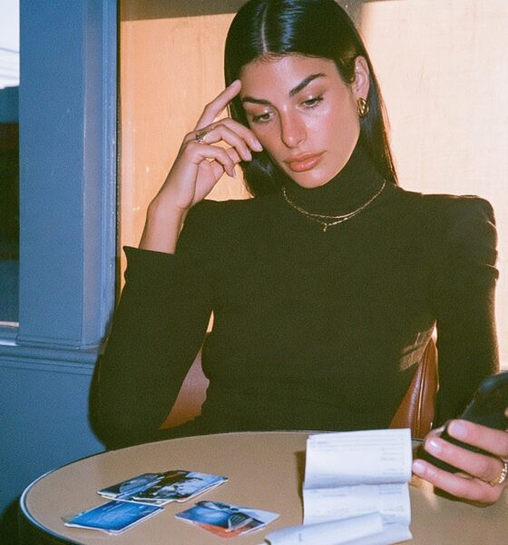 A woman looking at what money she has saved and what she can spend to purchase things