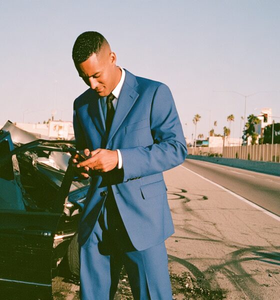 Entrepreneur man in a car crash on his phone