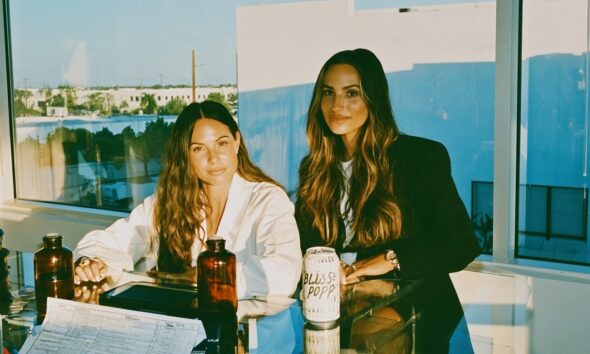 Female entrepreneurs with their beverage startup working on new flavors for their healthy soda beverage