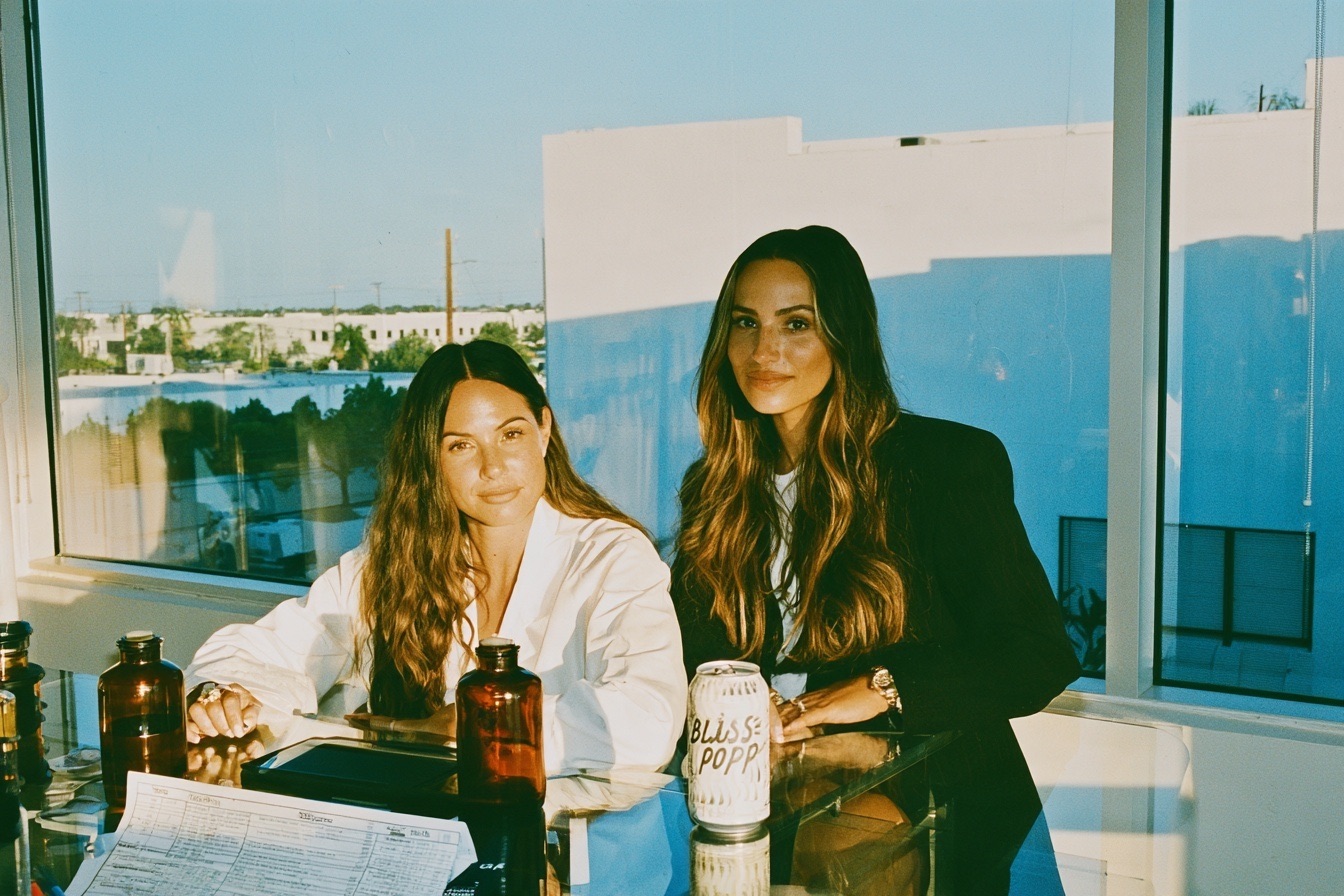 Female entrepreneurs with their beverage startup working on new flavors for their healthy soda beverage