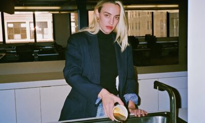 Female worker in burnout pouring her coffee down the sink