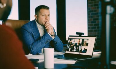 Male Founder sitting at desk on a zoom call using an AI note taker
