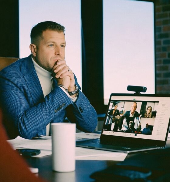 Male Founder sitting at desk on a zoom call using an AI note taker