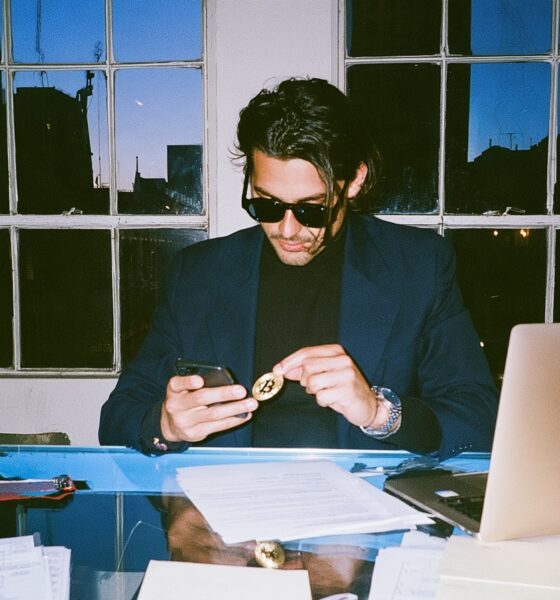 Man looking at his crypto trades in his home office