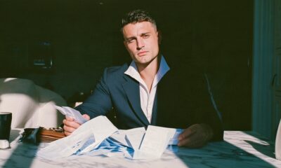Man looking at his finances and he is trying to work out how to save more money for his startup business