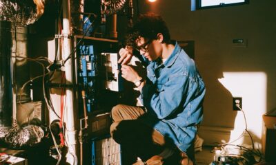 Man working on a furnace in his basement