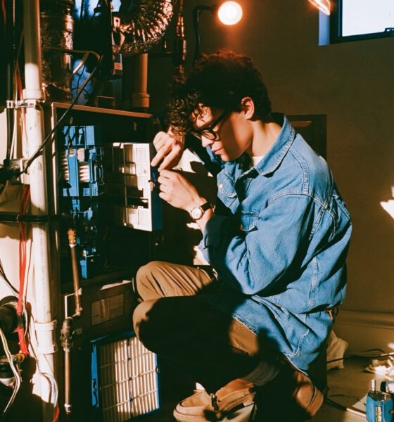 Man working on a furnace in his basement