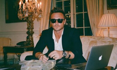 Wealthy man managing his money with his credit card and cash