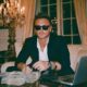 Wealthy man managing his money with his credit card and cash