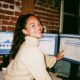 Woman looking at branding and marketing dashboard on her computer